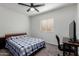 Cozy bedroom with a blue-checkered bed and a ceiling fan overhead at 2112 E Minton Dr, Tempe, AZ 85282