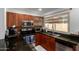 Efficient kitchen featuring stainless steel appliances, tile backsplash, and dark countertops at 2112 E Minton Dr, Tempe, AZ 85282