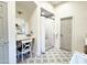 Serene bathroom with a vanity area, tiled shower, and patterned floor tiles for a modern touch at 21491 S 185Th Way, Queen Creek, AZ 85142