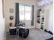 Playful bedroom featuring a drum set, cloud light fixture, and a neatly organized bookshelf at 21491 S 185Th Way, Queen Creek, AZ 85142