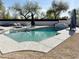 Inviting backyard pool area with lounge chairs, umbrellas and a decorative tile water feature at 21491 S 185Th Way, Queen Creek, AZ 85142