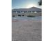 Spacious gravel backyard with privacy fence at 21696 E Arroyo Verde Dr, Queen Creek, AZ 85142