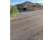 Gravel backyard view of a single-story home with fenced-in yard at 21696 E Arroyo Verde Dr, Queen Creek, AZ 85142