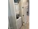 A practical laundry area featuring a stacked washer and dryer at 21696 E Arroyo Verde Dr, Queen Creek, AZ 85142