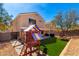 Spacious backyard with play structure, patio, and artificial turf, perfect for outdoor fun and relaxation at 21740 W Sonora St, Buckeye, AZ 85326