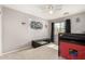 Bedroom featuring carpet floors, ceiling fan and monster truck themed decor at 21740 W Sonora St, Buckeye, AZ 85326