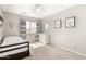 Cozy bedroom with modern window, natural light, and neutral decor at 21740 W Sonora St, Buckeye, AZ 85326