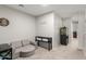 Living room featuring a sofa, aquarium, and carpet floors at 21740 W Sonora St, Buckeye, AZ 85326