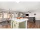 A lovely open concept living space with kitchen island, dining and a comfortable seating area at 21740 W Sonora St, Buckeye, AZ 85326