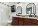 Bathroom with a granite countertop, double vanity, tub, and modern fixtures, creating a luxurious and practical space for daily use at 22319 E Via De Olivos --, Queen Creek, AZ 85142