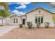 Charming single-story home featuring desert landscaping, tile roof and decorative window details at 22319 E Via De Olivos --, Queen Creek, AZ 85142