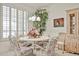 Cozy dining area with chandelier lighting and views to the side yard at 23106 N 146Th Ln, Sun City West, AZ 85375