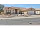 Inviting single-story home with desert landscaping, barrel tile roof and two-car garage at 23106 N 146Th Ln, Sun City West, AZ 85375