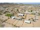 Wide aerial view showcases a property in a suburban desert community with surrounding mountain views at 2349 W Skyline Ln, San Tan Valley, AZ 85144