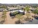 Stunning aerial view of the property showcasing a modern home with mature landscaping and neighborhood views at 2349 W Skyline Ln, San Tan Valley, AZ 85144