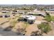 An aerial view showcases the layout of a property with a distinctive roof design and a surrounding landscape at 2349 W Skyline Ln, San Tan Valley, AZ 85144