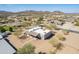 Aerial view of a custom home with desert landscaping and mountain views at 2349 W Skyline Ln, San Tan Valley, AZ 85144