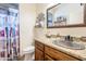 Stylish bathroom featuring a unique sink, granite countertops, and decorative touches at 2349 W Skyline Ln, San Tan Valley, AZ 85144