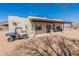 Desert home featuring a covered patio, neutral paint, and clear blue sky at 2349 W Skyline Ln, San Tan Valley, AZ 85144