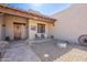 Inviting covered front porch with seating area at 2349 W Skyline Ln, San Tan Valley, AZ 85144