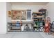 Garage space including ample storage, a workbench, and a pegboard for organizing tools at 2349 W Skyline Ln, San Tan Valley, AZ 85144