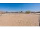 Large horse arena with various equestrian facilities in the background at 2349 W Skyline Ln, San Tan Valley, AZ 85144