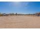 Large horse arena with sandy surface, surrounded by fencing at 2349 W Skyline Ln, San Tan Valley, AZ 85144