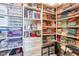 Organized walk-in closet with built-in shelving and ample storage space at 2349 W Skyline Ln, San Tan Valley, AZ 85144