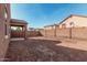 Empty backyard with block fence and covered patio at 2530 W Gaby Rd, Phoenix, AZ 85041