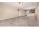 Spacious carpeted living room leading to the kitchen and adjacent living spaces at 2530 W Gaby Rd, Phoenix, AZ 85041