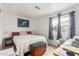 Guest bedroom featuring neutral walls, natural light, and ample closet space at 2650 W Union Hills Dr # 329, Phoenix, AZ 85027