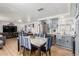 Open floor plan dining room with blue accents and a marble-topped table at 2650 W Union Hills Dr # 329, Phoenix, AZ 85027