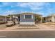 Charming home exterior featuring a covered carport and well-maintained landscaping at 2650 W Union Hills Dr # 329, Phoenix, AZ 85027