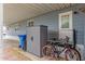 Covered exterior of home featuring a storage shed, trash can, and bicycle, creating functional outdoor space at 2650 W Union Hills Dr # 329, Phoenix, AZ 85027