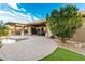 Beautiful backyard featuring a pool, outdoor kitchen, covered patio, and mature landscaping at 3110 E Cat Balue Dr, Phoenix, AZ 85050