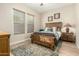 Cozy bedroom with natural light, wood furniture and southwestern decor at 3110 E Cat Balue Dr, Phoenix, AZ 85050