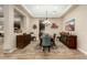 Elegant dining room with decorative rug and stylish furnishings and attractive light fixture at 3110 E Cat Balue Dr, Phoenix, AZ 85050