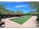 Bocce ball court and seating area in manicured landscaping for a relaxing recreation area at 32241 N Dog Leg Ct, San Tan Valley, AZ 85143