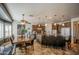 Open dining area with dark wood table, decorative light fixtures, and direct access to the kitchen at 32241 N Dog Leg Ct, San Tan Valley, AZ 85143