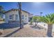 Charming single-story home with low-maintenance desert landscaping and a stone-accented facade at 32241 N Dog Leg Ct, San Tan Valley, AZ 85143