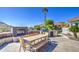 Outdoor kitchen and dining area, complete with a built-in grill and fireplace, perfect for al fresco dining at 32241 N Dog Leg Ct, San Tan Valley, AZ 85143