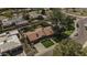 Aerial view of the property showcasing the mature trees, lush backyard, and neighborhood at 325 E Aepli Dr, Tempe, AZ 85282