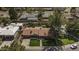 Aerial view of a well-maintained home with beautiful landscaping and mature trees in a quiet neighborhood at 325 E Aepli Dr, Tempe, AZ 85282