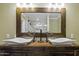 Bathroom with dual vessel sinks and a rustic wooden vanity, illuminated by vanity lighting at 325 E Aepli Dr, Tempe, AZ 85282