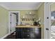 Inviting butler pantry with dark cabinetry and butcher block countertops at 325 E Aepli Dr, Tempe, AZ 85282