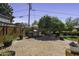 Outdoor patio area with BBQ, brick pavers, and mature landscaping at 325 E Aepli Dr, Tempe, AZ 85282