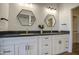 Elegant bathroom featuring dual sinks, hexagonal mirrors, and modern fixtures at 3302 N 7Th St # 364, Phoenix, AZ 85014