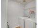 Laundry room with washer, dryer, and wire shelving at 3302 N 7Th St # 364, Phoenix, AZ 85014