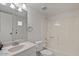 Bathroom featuring a vanity, toilet, and shower-tub combo at 3309 N 70Th St # 108, Scottsdale, AZ 85251