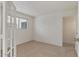 Bright bedroom featuring neutral carpet, a window with blinds, and white walls at 3309 N 70Th St # 108, Scottsdale, AZ 85251